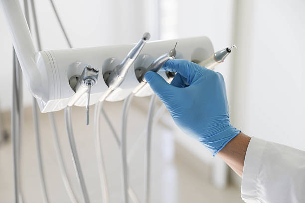 Professional Tooth Extraction technician working in Oswego, NY